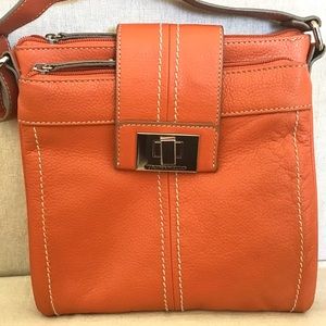 Orange Tignanello leather crossbody purse.